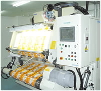 欠点検知機付巻替検品機